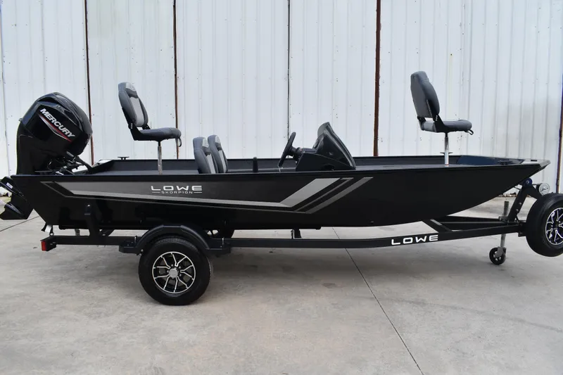 The Image of 2025 Lowe Skorpion 17 fishing boat on trailer, featuring Mercury outboard motor. - 0
