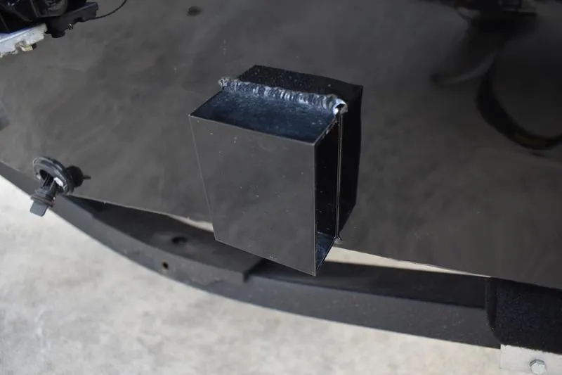 Slide: The Image of Close-up of '60' on 2025 Lowe Skorpion 17, reflecting cloudy sky. - 10