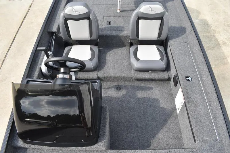 Slide: The Image of 2025 Lowe Skorpion 17 boat interior with dual seats and steering console. - 20