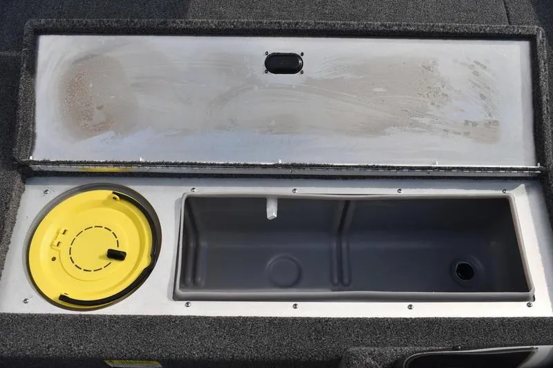Slide: The Image of Livewell compartment of 2025 Lowe Skorpion 17 boat, featuring a yellow lid and spacious interior. - 21