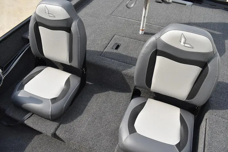 Slide: The Image of 2025 Lowe Skorpion 17 boat dashboard with steering wheel and gauges. - 26