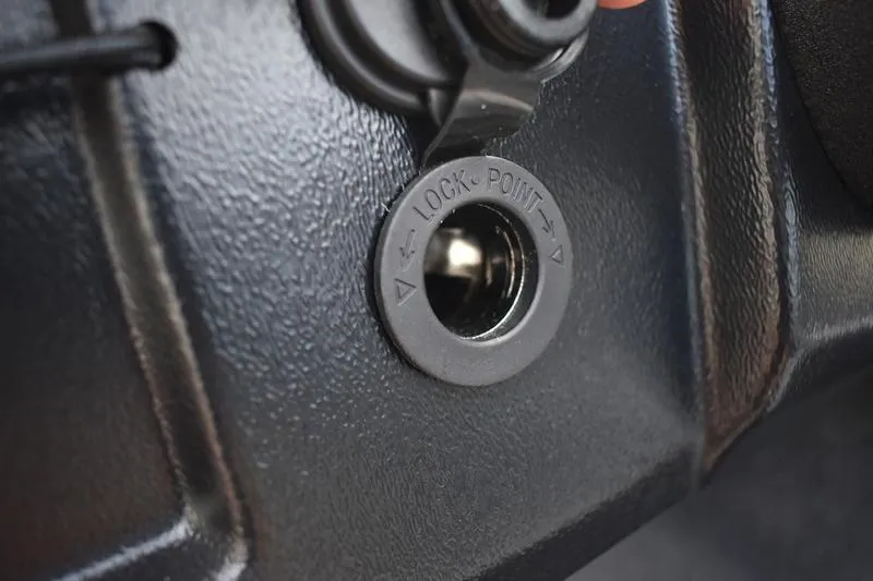 Slide: The Image of Close-up of a 2025 Lowe Skorpion 17 lock point on black surface. - 28