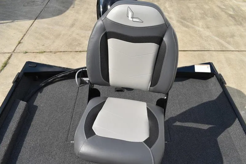 Slide: The Image of 2025 Lowe Skorpion 17 boat deck with carpeted surface and storage compartments. - 32