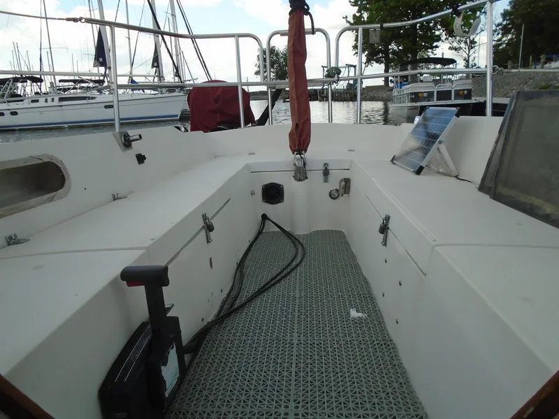Slide: The Image of Interior view of a 1988 Catalina 27 sailboat docked at marina. - 2