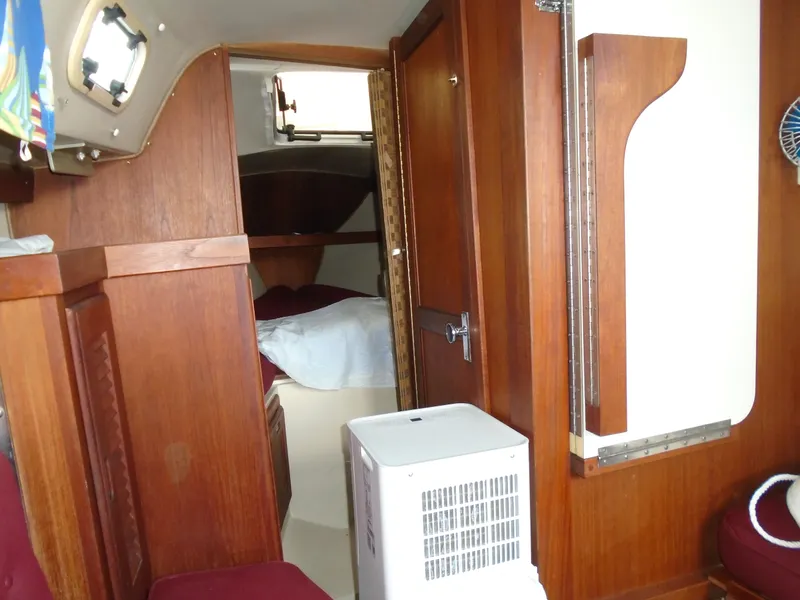 Slide: The Image of Interior of a 1988 Catalina 27 sailboat with wooden furnishings. - 3
