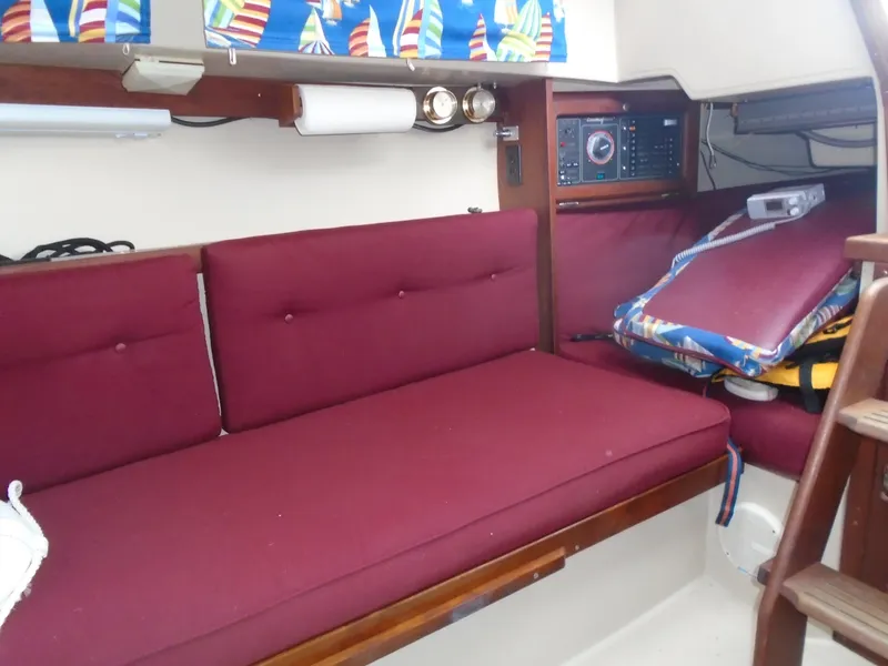 Slide: The Image of Interior of a 1988 Catalina 27 yacht with red cushions. - 4