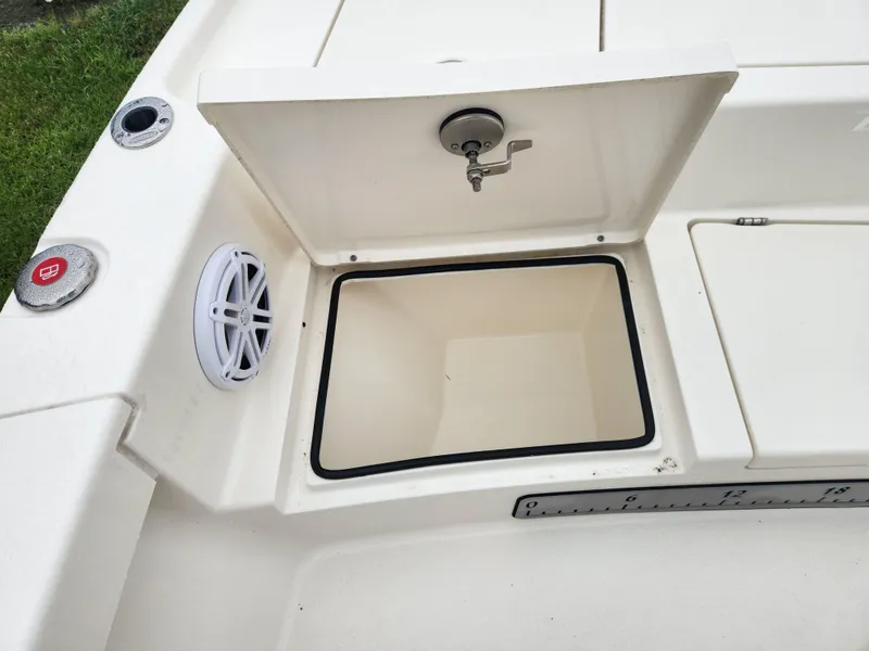 Slide: The Image of 2024 Pathfinder 2500 Hybrid boat storage compartment with speaker and latch. - 12