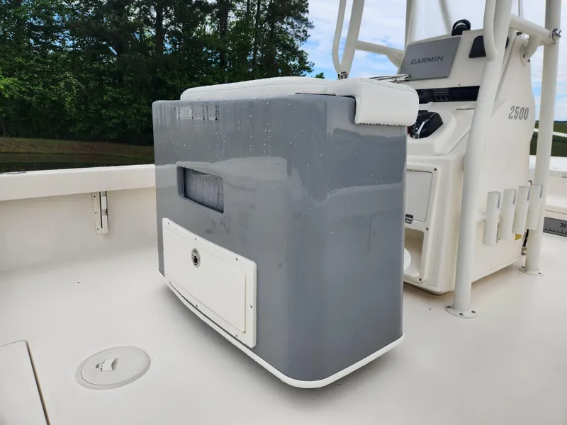 Slide: The Image of 2024 Pathfinder 2500 Hybrid boat console with Garmin equipment, featuring sleek design and storage. - 17