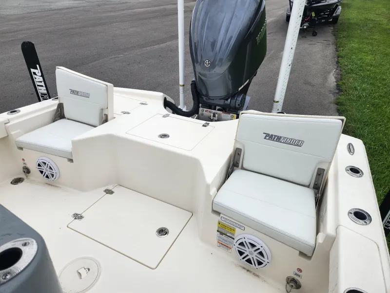 Slide: The Image of 2024 Pathfinder 2500 Hybrid boat interior with seating and motor, showcasing modern design. - 19