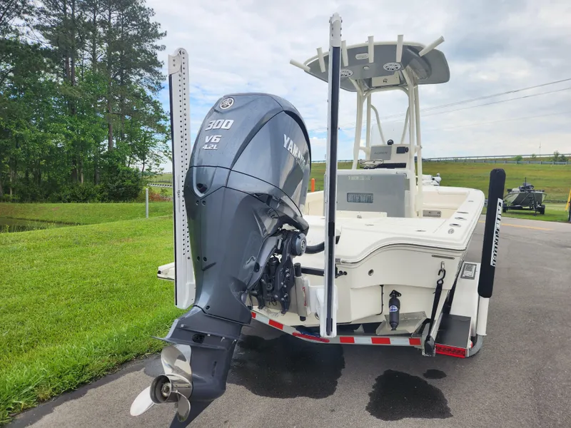 Slide: The Image of 2024 Pathfinder 2500 Hybrid boat with Yamaha V6 engine on a trailer. - 4