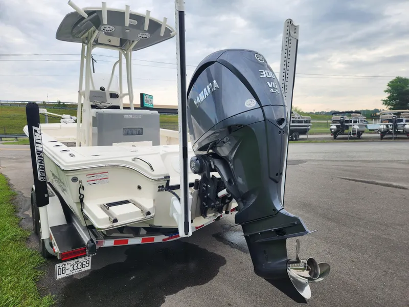 Slide: The Image of 2024 Pathfinder 2500 Hybrid boat with Yamaha V6 engine, parked on a trailer. - 5