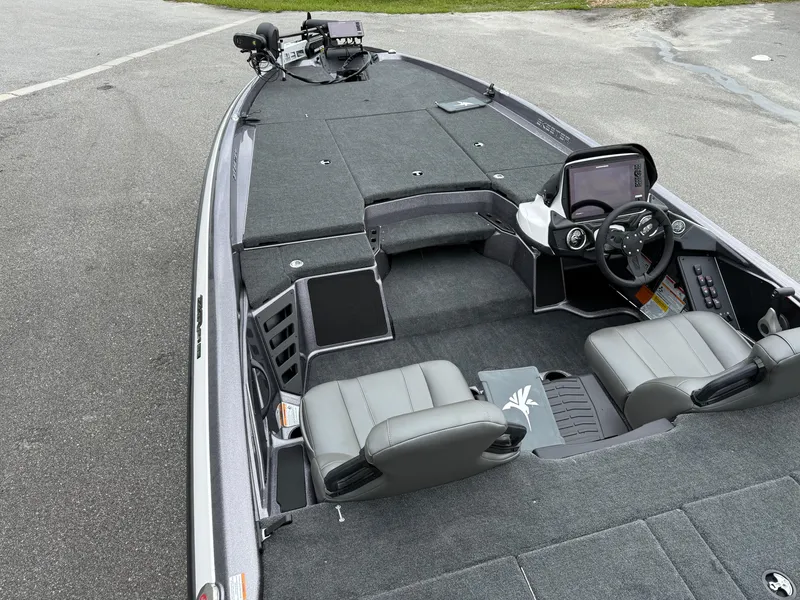 Slide: The Image of 2025 Skeeter ZXR 21 SE boat interior with dual seats and advanced dashboard. - 14