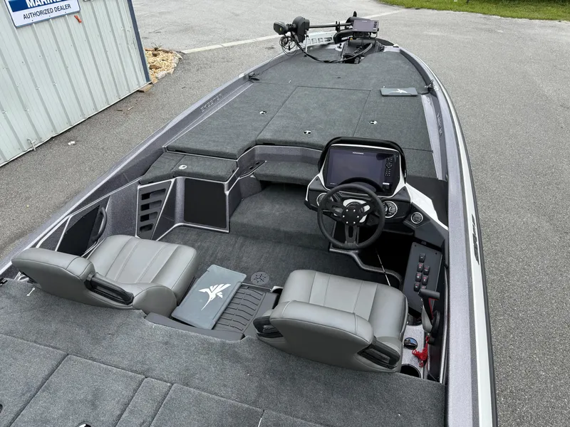 Slide: The Image of 2025 Skeeter ZXR 21 SE boat interior with dual seats and advanced dashboard. - 16