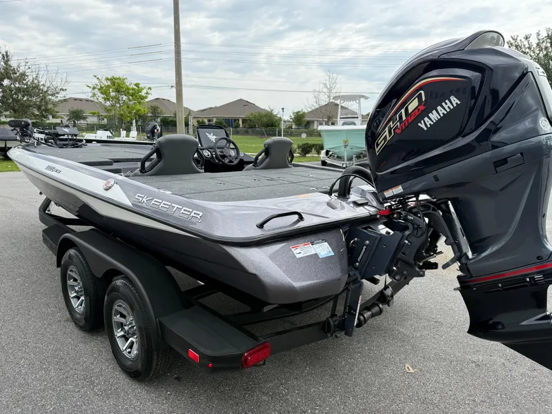 Slide: The Image of 2025 Skeeter ZXR 21 SE boat with Yamaha motor on a trailer. - 17