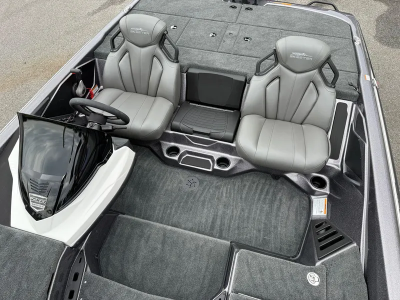 Slide: The Image of 2025 Skeeter ZXR 21 SE boat interior with gray seats and steering console. - 8
