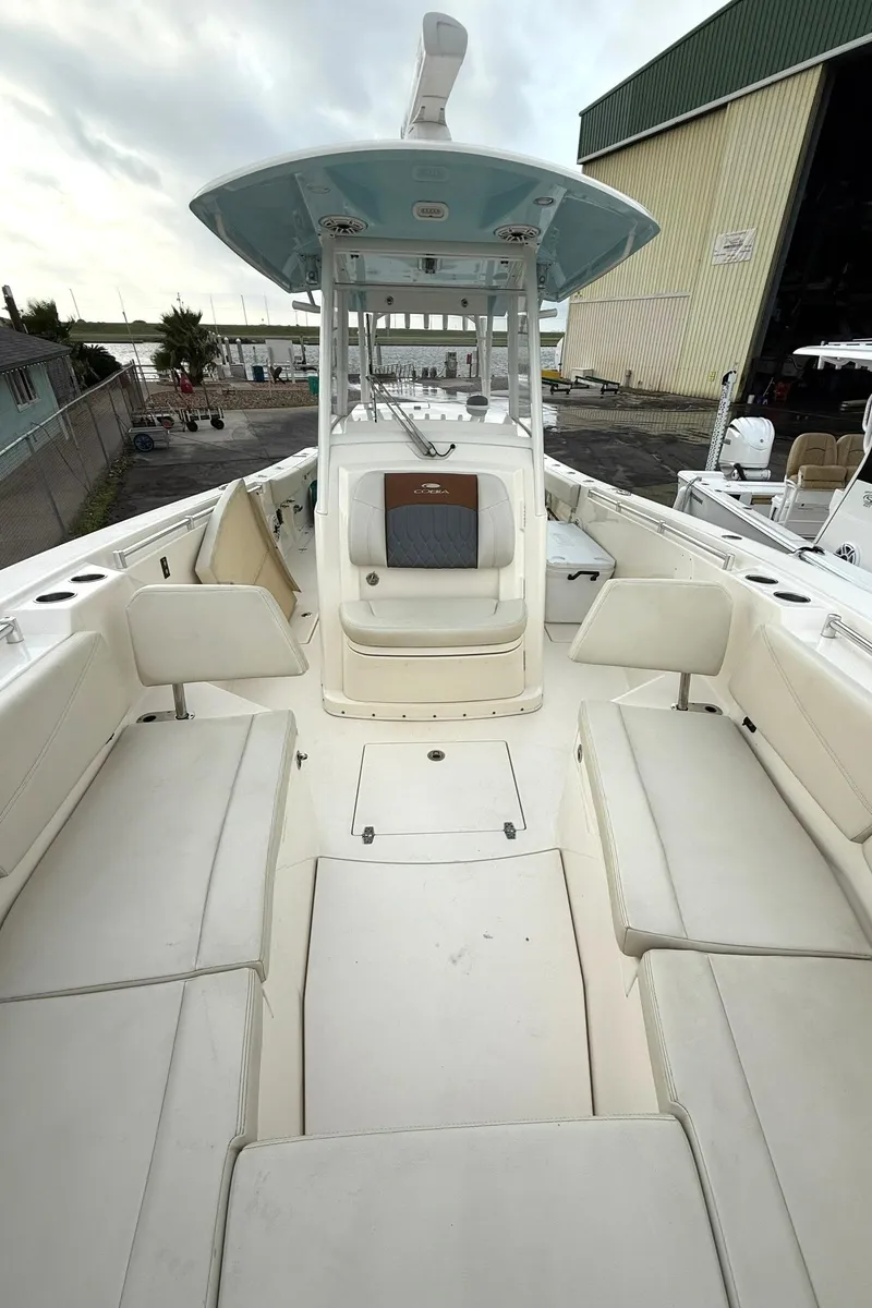 Slide: The Image of 2020 Cobia 320 Center Console boat with spacious seating and modern design. - 11
