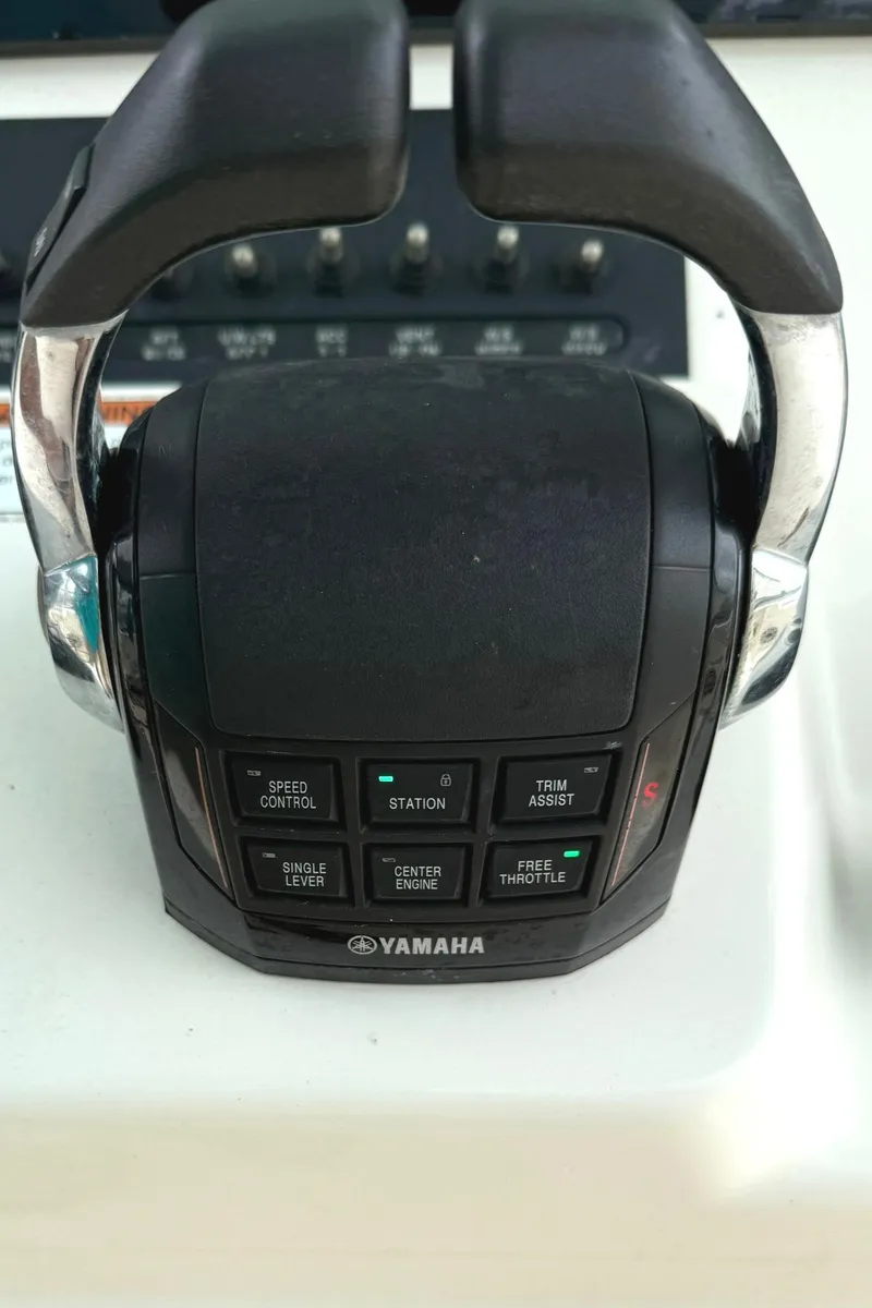 Slide: The Image of Yamaha throttle control on 2020 Cobia 320 Center Console boat. - 18