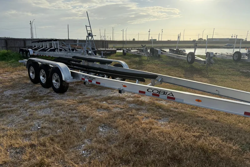 Slide: The Image of Trailer for 2020 Cobia 320 Center Console, parked outdoors on grassy lot. - 22