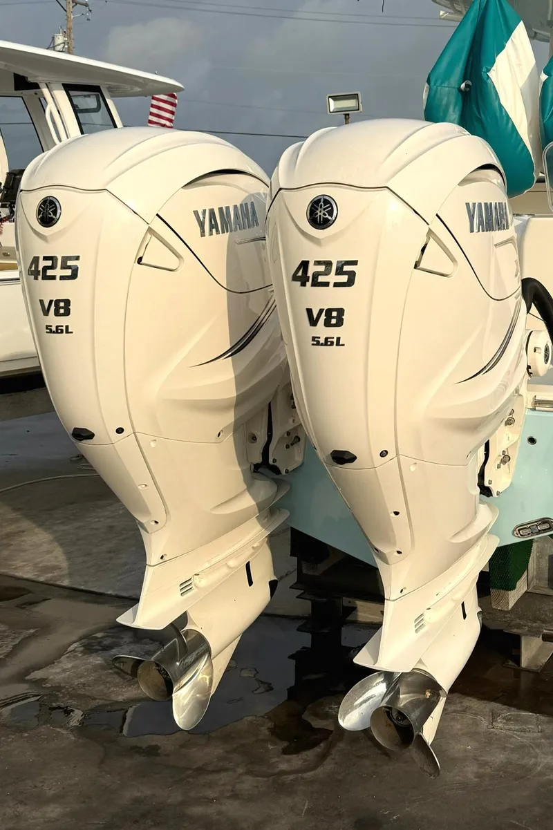 Slide: The Image of Twin Yamaha 425 V8 outboard engines on a 2020 Cobia 320 Center Console boat. - 6