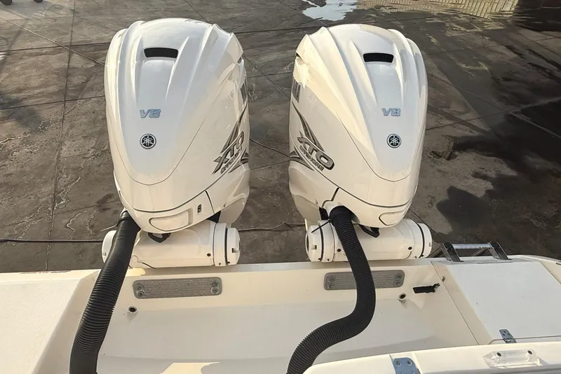 Slide: The Image of Twin Yamaha V8 outboard engines on a 2020 Cobia 320 Center Console boat. - 7