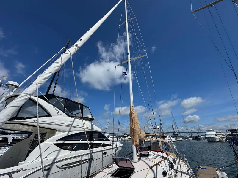 Slide: The Image of Sailboat Sabre 362, 2000 model, docked in a marina under a clear blue sky. - 10
