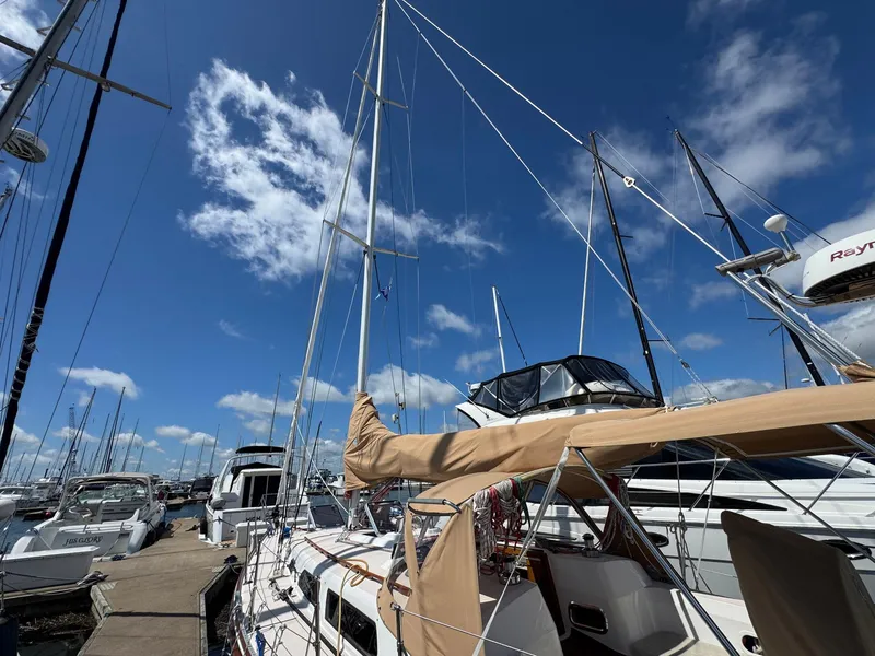 Slide: The Image of Sailboat Sabre 362, 2000 model, docked at marina under clear blue sky. - 12