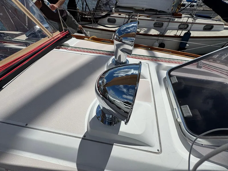 Slide: The Image of Chrome vents on a 2000 Sabre 362 yacht deck, reflecting the sky. - 13