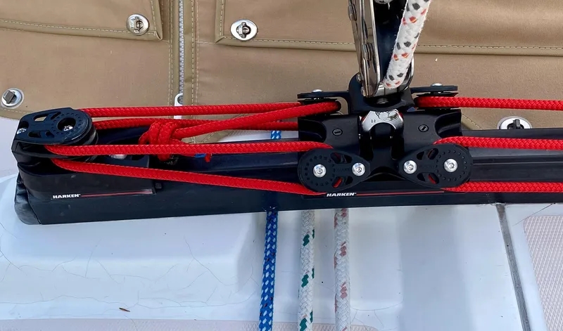 Slide: The Image of Sailing rigging on a 2000 Sabre 362 with red and blue ropes. - 15
