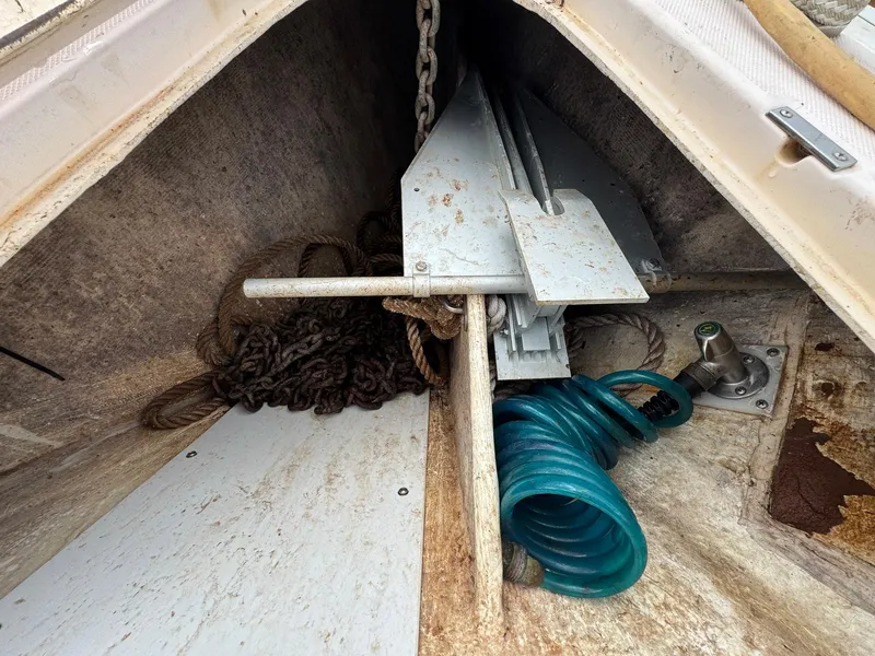 Slide: The Image of Anchor locker of 2000 Sabre 362 sailboat with chain, rope, and hose. - 19