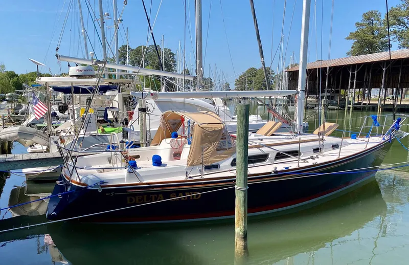 Slide: The Image of 2000 Sabre 362 sailboat docked in a marina, surrounded by other boats. - 2