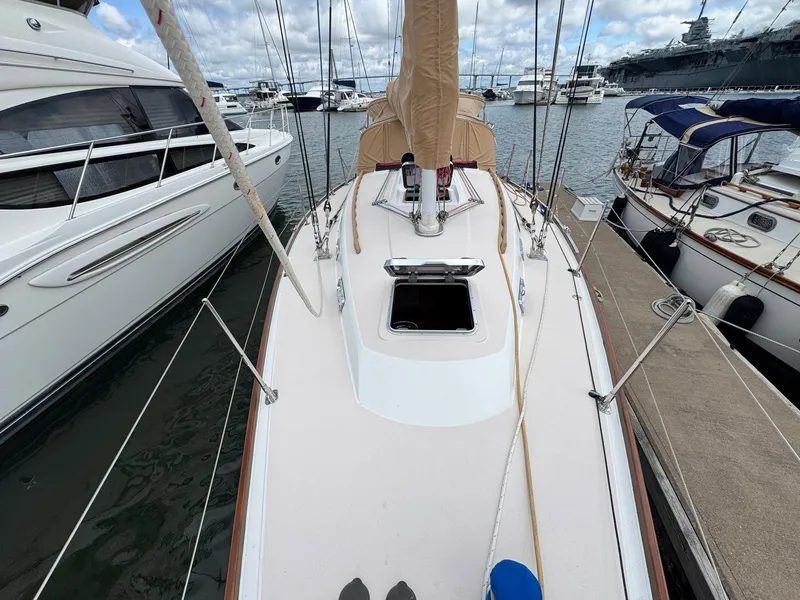 Slide: The Image of 2000 Sabre 362 sailboat docked at marina, surrounded by other boats. - 21