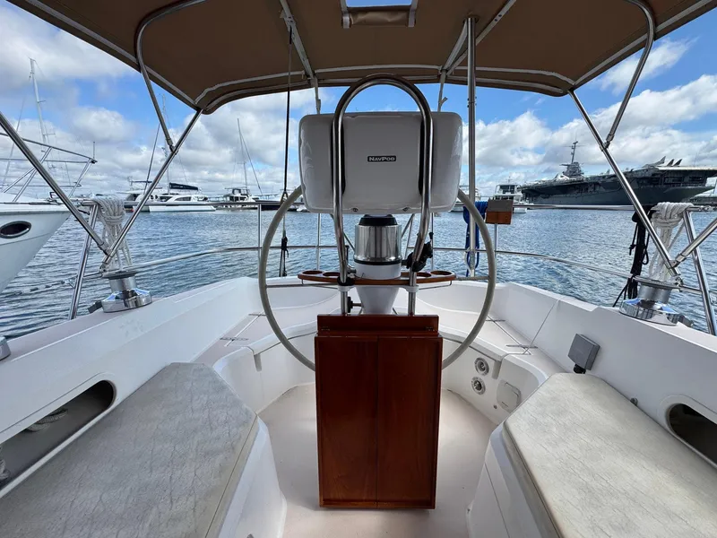 Slide: The Image of Cockpit view of 2000 Sabre 362 sailboat with marina background. - 25