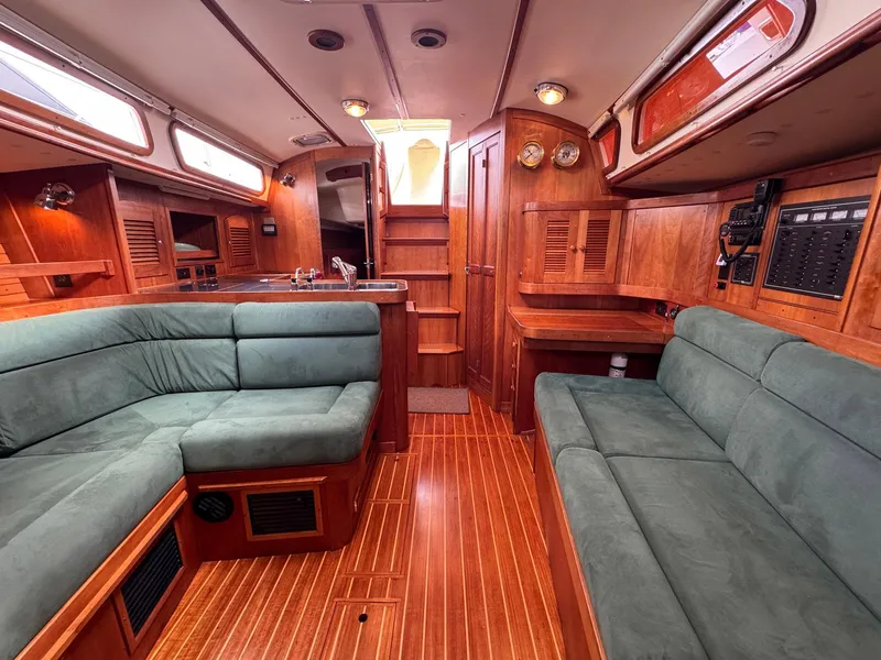 Slide: The Image of Luxurious interior of 2000 Sabre 362 sailboat with plush seating and wooden finishes. - 34