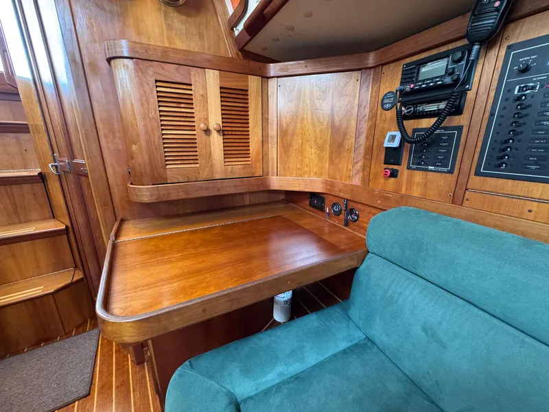 Slide: The Image of Interior of 2000 Sabre 362 sailboat with wooden cabinetry and navigation equipment. - 40