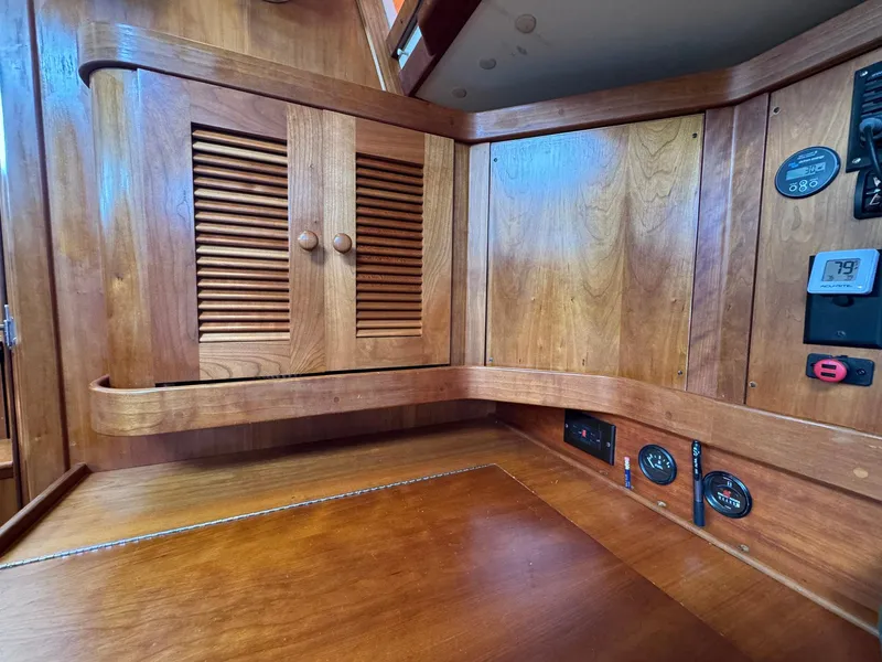 Slide: The Image of Interior of 2000 Sabre 362 sailboat with wooden cabinetry and control panel. - 41