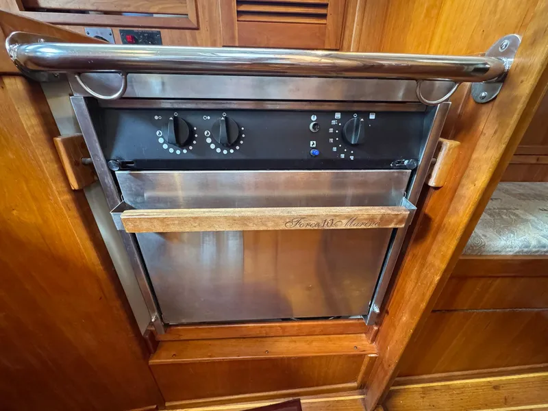 Slide: The Image of Stainless steel oven in 2000 Sabre 362 yacht galley with wooden accents. - 48