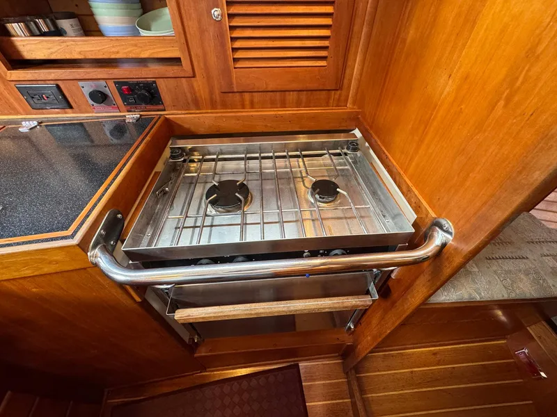 Slide: The Image of Compact kitchen area with a two-burner stove on a 2000 Sabre 362 yacht. - 49