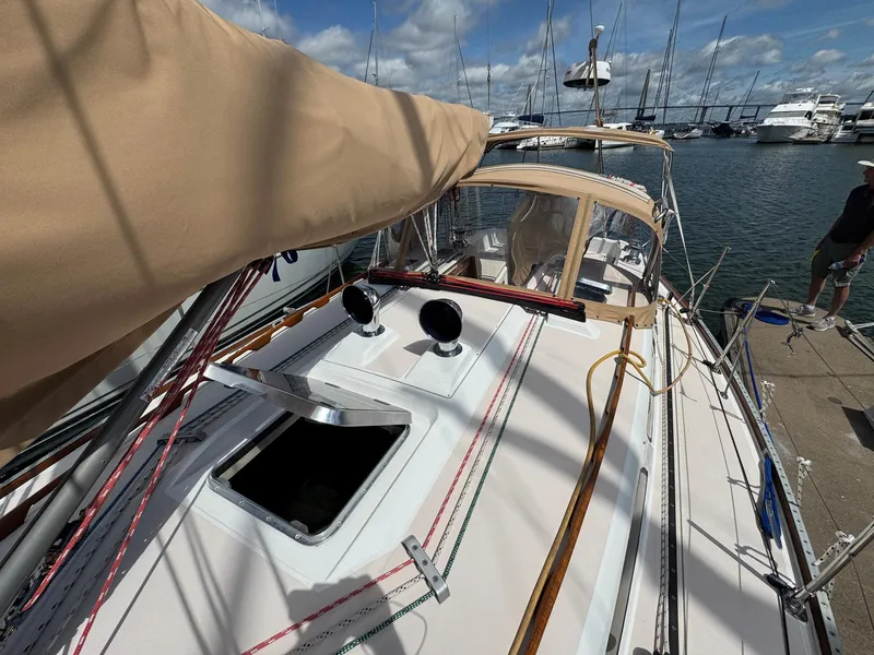 Slide: The Image of Sailboat Sabre 362, 2000 model, docked at marina with clear sky. - 5