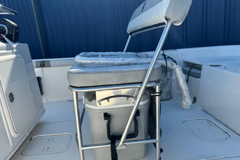 Slide: The Image of 2026 Carolina Skiff 19 LS boat interior with cushioned seating and storage. - 12