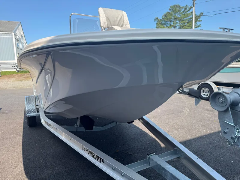 Slide: The Image of 2025 Carolina Skiff 19 LS boat on trailer, parked outdoors. - 3