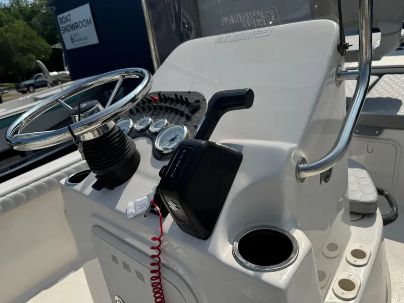 Slide: The Image of 2025 Carolina Skiff 19 LS boat console with steering wheel and controls. - 5