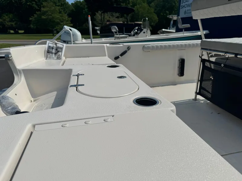 Slide: The Image of 2025 Carolina Skiff 19 LS boat interior with seating and storage compartments. - 7