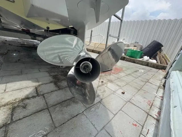 Slide: The Image of Propeller of 1997 Sport-Craft 232 Sportfish boat on paved surface. - 8