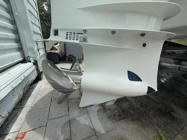 Slide: The Image of Propeller of a 1997 Sport-Craft 232 Sportfish boat on a tiled surface. - 9