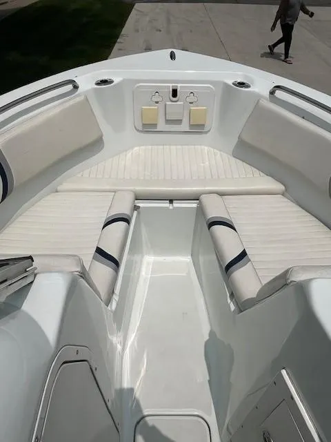 Slide: The Image of 2006 Polar Dynasty 2100 DC boat interior with white seating and deck. - 11