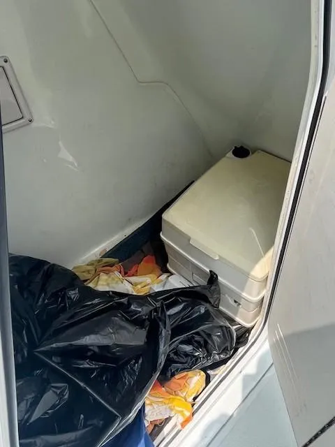 Slide: The Image of Interior of a 2006 Polar / Dynasty 2100 DC boat with storage items. - 13