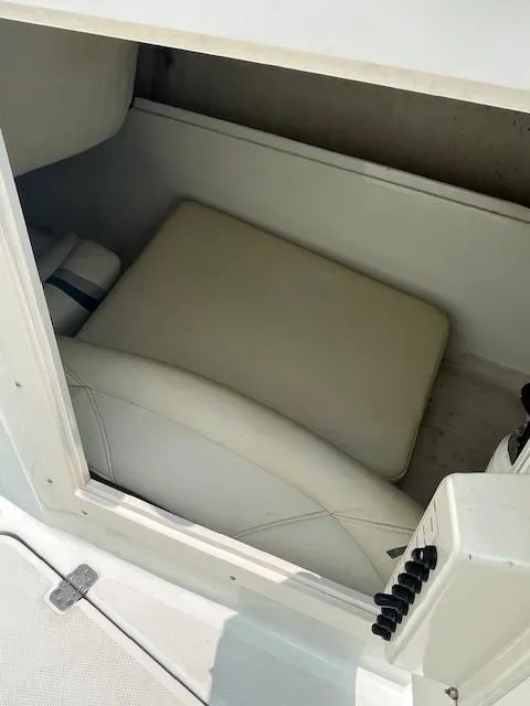 Slide: The Image of 2006 Polar Dynasty 2100 DC boat storage compartment with cushioned seating. - 14