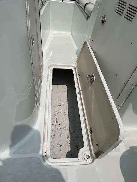 Slide: The Image of Open storage compartment on a 2006 Polar Dynasty 2100 DC boat. - 15