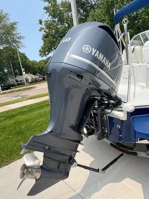 Slide: The Image of Yamaha outboard motor on 2006 Polar/Dynasty 2100 DC boat, parked on a sunny day. - 4