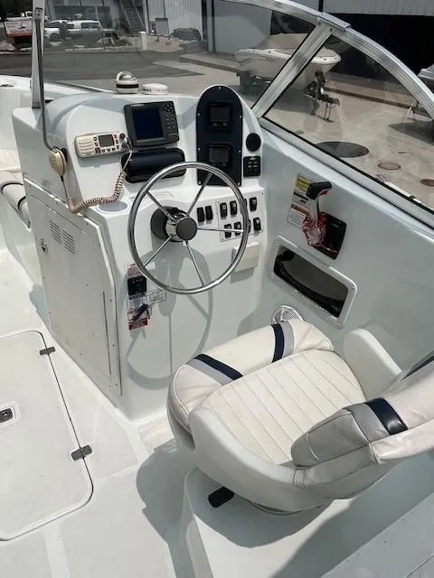 Slide: The Image of 2006 Polar Dynasty 2100 DC boat cockpit with steering wheel and navigation equipment. - 7